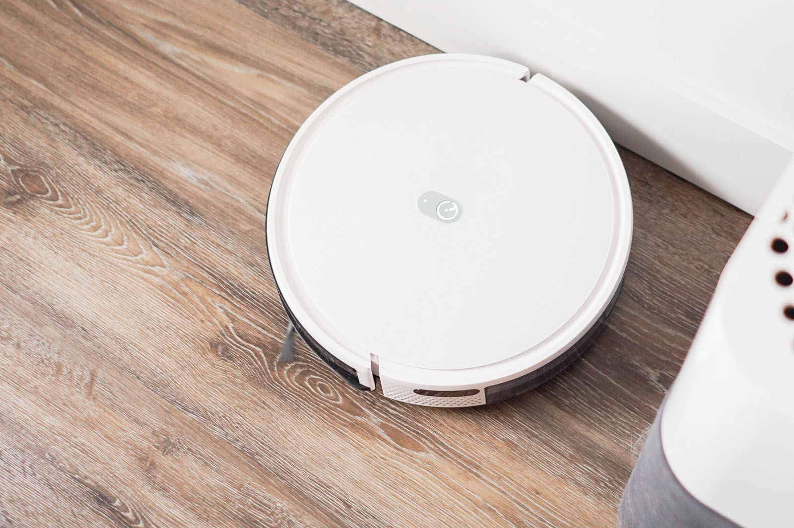 Yeedi K650 robot vacuum on floor in corner